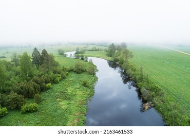 High angle view to a misty river landscape on a late spring morning in Estonia, Northern Europe - Shutterstock ID 2163461533