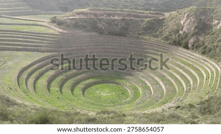 High angle view of the Moray archaeological site in the Sacred Valley, Peru. Circular Inca agricultural terraces designed for microclimate experiments