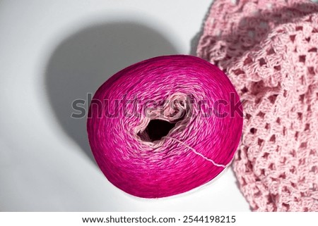 High angle view of multi colored ball with cotton fibre and polyacrylicmix agains white background. Photo taken November 12th, 2024, Zurich, Switzerland.