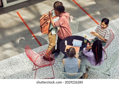 High Angle View At Multi-ethnic Group Of Kids Meeting At Table Outdoors During Lunch At Modern School, Copy Space