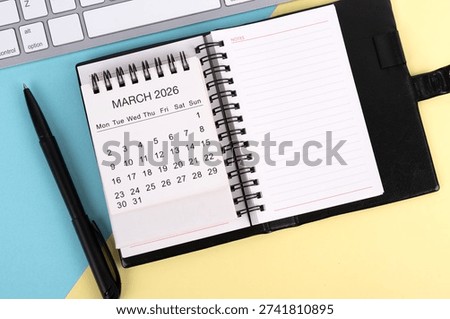 High angle view of notepad and March 2026 Calendar Flat Lay