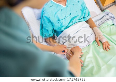 Similar – Doctor giving a prescription to senior patient