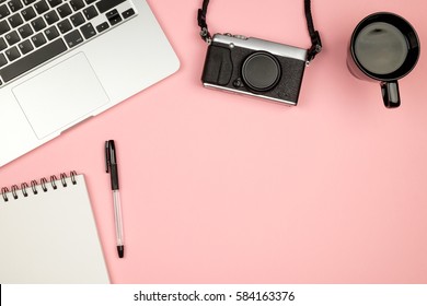 High Angle View Of Office Colored Desk With Copy Space. Table With Laptop And Supplies. Top View. Flat Lay. Freelancer Or Student Desk