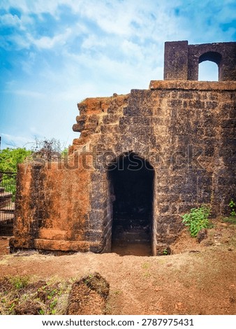 High angle view of an old arched passageway and stone steps in Mirjan Fort.