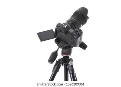 High angle view on massive black still-shot camera on tripod isolated