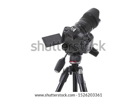 High angle view on massive black still-shot camera on tripod isolated