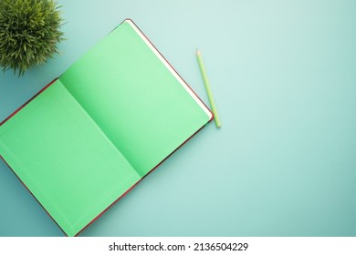high angle view of open notepad on light color background 