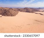 High angle view over a desert landscape, with dry rocky mountains