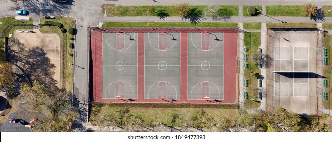 A High Angle View Over An Empty Grant Park With Basketball Courts, Tennis Courts & Colorful Baseball Fields. It Is A Sunny Day And There Are No People In Sight.