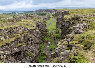 High angle view over the seismic rift valley between the Eurasian and North American tectonic plates in Thingvellir National Park, Iceland with Pingvallavatn lake in background