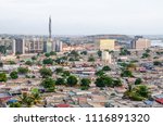 High angle view over slums of Luanda with Mausoleum of Agostinho Neto tower in background, Angola, Africa