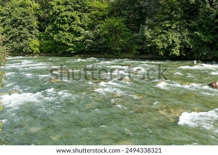 High angle view of Passer River with rapids and rocks at City of Meran on a sunny summer day. Photo taken July 15th, 2024, Merano Meran, Italy.