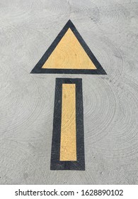 High angle view of a pavement marking for driving direction in a parking structure