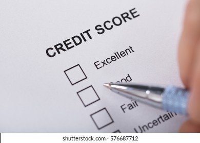 High Angle View A Person Filling Credit Score Form