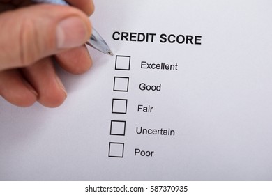 High Angle View A Person Filling Credit Score Form