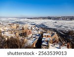 
High angle view of the Petit-Champlain old town sector, with the partly frozen St. Lawrence river and the south shore seen during a sunny afternoon, Quebec City, Quebec, Canada