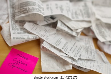High Angle View of Pile of Receipts with Home Office Expenses Pink Sticky Note on Table - Shutterstock ID 2144275173
