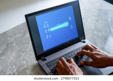 High angle view of professional hands typing on laptop with business infographic dashboard on screen.