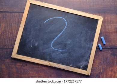 high angle view of question mark on chalkboard 