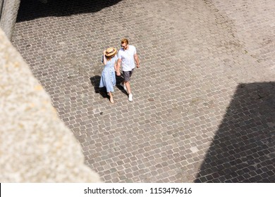 High Angle View Of Redhead Couple Walking At Urban Street