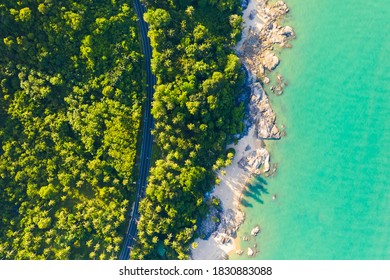 High angle view of  road pass through coconut tree forest and beautiful coastline in Khanom, Nakhon si thammarat, Thailand