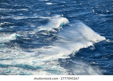 High angle view of rough sea with whitecaps and wind-blown spray on the Aegean Sea, South Aegean, Greece, Europe