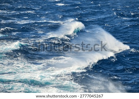 High angle view of rough sea with whitecaps and wind-blown spray on the Aegean Sea, South Aegean, Greece, Europe