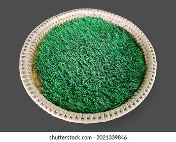 High Angle View Of Round Woven Basket With Green Grass Isolated On Gray