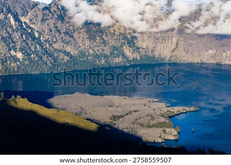 High angle view of Segara Anak crater lake and volcanic cone at Mount Rinjani, Indonesia