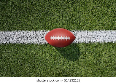 High Angle View Shot Of A Traditional American Football Ball A Field With Copyspace