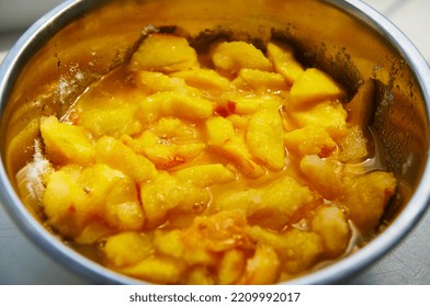 High Angle View Sliced Organic Peaches, Stirred With Sugar In A Metal Bowl. Preparing Homemade Jam. Canning Food. Marmalade. Confiture. Selective Focus. Making Preserves For The Winter. Close-up