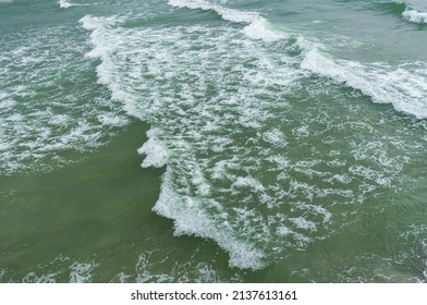 High Angle View Of Small Waves Near The Coast Can See The Turbidity Of The Sea