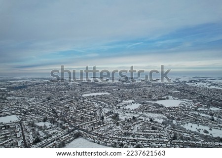 High angle view of Snow covered landscape and Cityscape, Aerial Footage of Luton City of England UK after Snow Fall. The 1st Snow Fall of this Winter of 2022