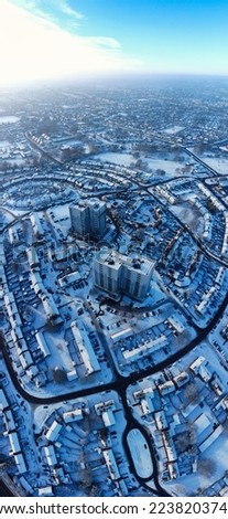 High angle view of Snow covered North Luton's landscape and Cityscape, Aerial Footage of Luton City of England UK after Snow Fall. The 1st Snow Fall of this Winter of 2022