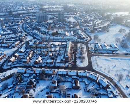High angle view of Snow covered North Luton's landscape and Cityscape, Aerial Footage of Luton City of England UK after Snow Fall. The 1st Snow Fall of this Winter of 2022