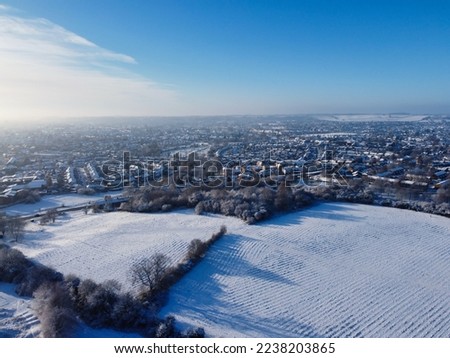High angle view of Snow covered North Luton's landscape and Cityscape, Aerial Footage of Luton City of England UK after Snow Fall. The 1st Snow Fall of this Winter of 2022