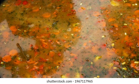 High Angle View Of Soup In A Cast Iron Vat. Close-up Of Cooking Meal.