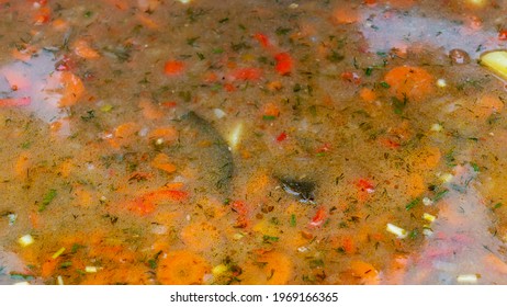 High Angle View Of Soup In A Cast Iron Vat. Close-up Of Cooking Meal.