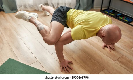 High Angle View Of Sportive Man Standing On His Arms And Legs In The Air. Hard Yoga Pose. Fitness, Healthy Lifestyle, Stay Home Concept. Web Banner