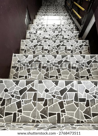 High Angle View of Steep Concrete Stairs with Grey Mosaic Pattern Tiles