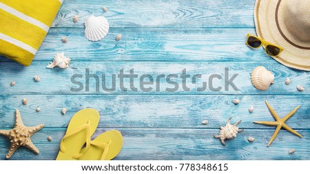 High angle view of summer, vacations, beach accessories on blue wooden background with copy space
