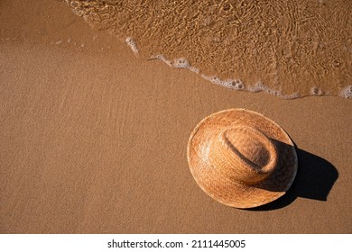 High Angle View Of A Sun Hat On The Beach. Summer Holidays. 