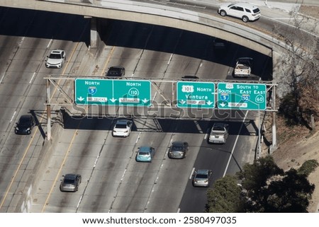 High angle view towards Los Angeles downtown freeway interchange signs.