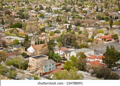 A High Angle View Of A Typical Housing Area In An Urban Area With A Variety Of Residential Buildings, Including Two Victorian Style Houses In The Foreground. San Jose, California.