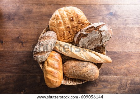 High Angle View Of A Variety Of Freshly Baked Bread In The Wicker Basket