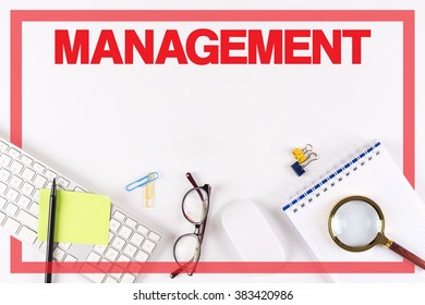 High Angle View of Various Office Supplies on Desk with a word MANAGEMENT