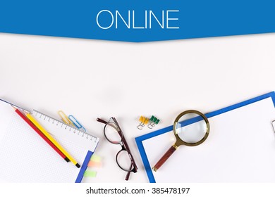 High Angle View of Various Office Supplies on Desk with a word ONLINE