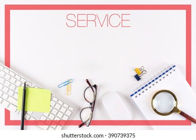 High angle view of various office supplies on desk with a word SERVICE