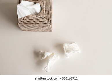 High Angle View Of White Rattan Tissue Box And Crumpled Tissues On Table - Cold And Flu Season Concept, Grief, Concept