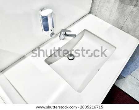 A high angle view of the white wash basin or sink at the bathroom.